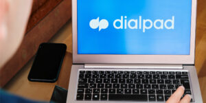 Dialpad is used for business meeting on laptop by man.