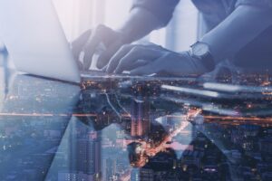 man working on laptop, best cities for tech jobs
