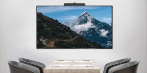 MAXHUB ND86PNA display mounted on a wall in a conference room.