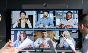 Employees using MAXHUB devices for collaboration with remote employees on the screen.